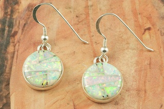 Stunning Fire and Ice Lab Opals inlaid between ribbons of Sterling Silver. Beautiful Sterling Silver French Wire Earrings feature precision channel inlay. Designed by Navajo Artist Calvin Begay. Signed.